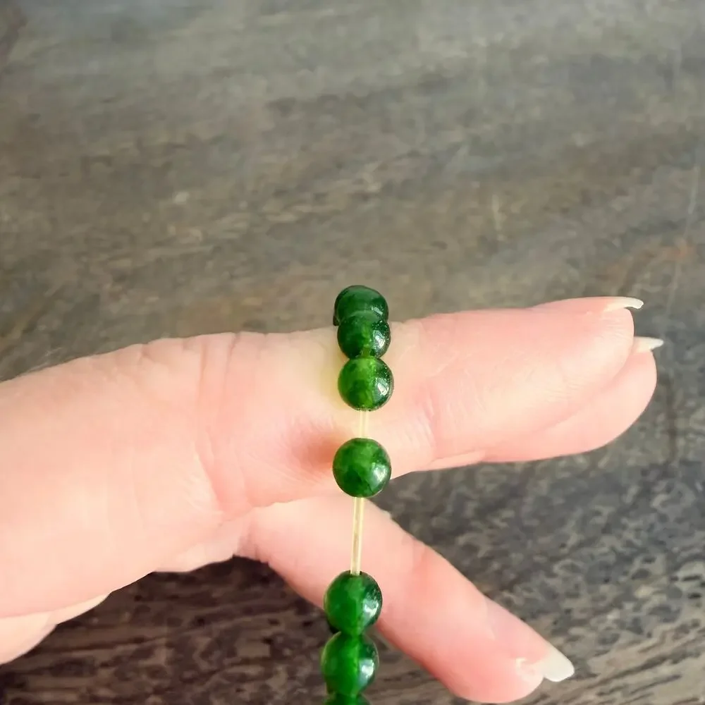 Green beaded bee charm stretch bracelet
